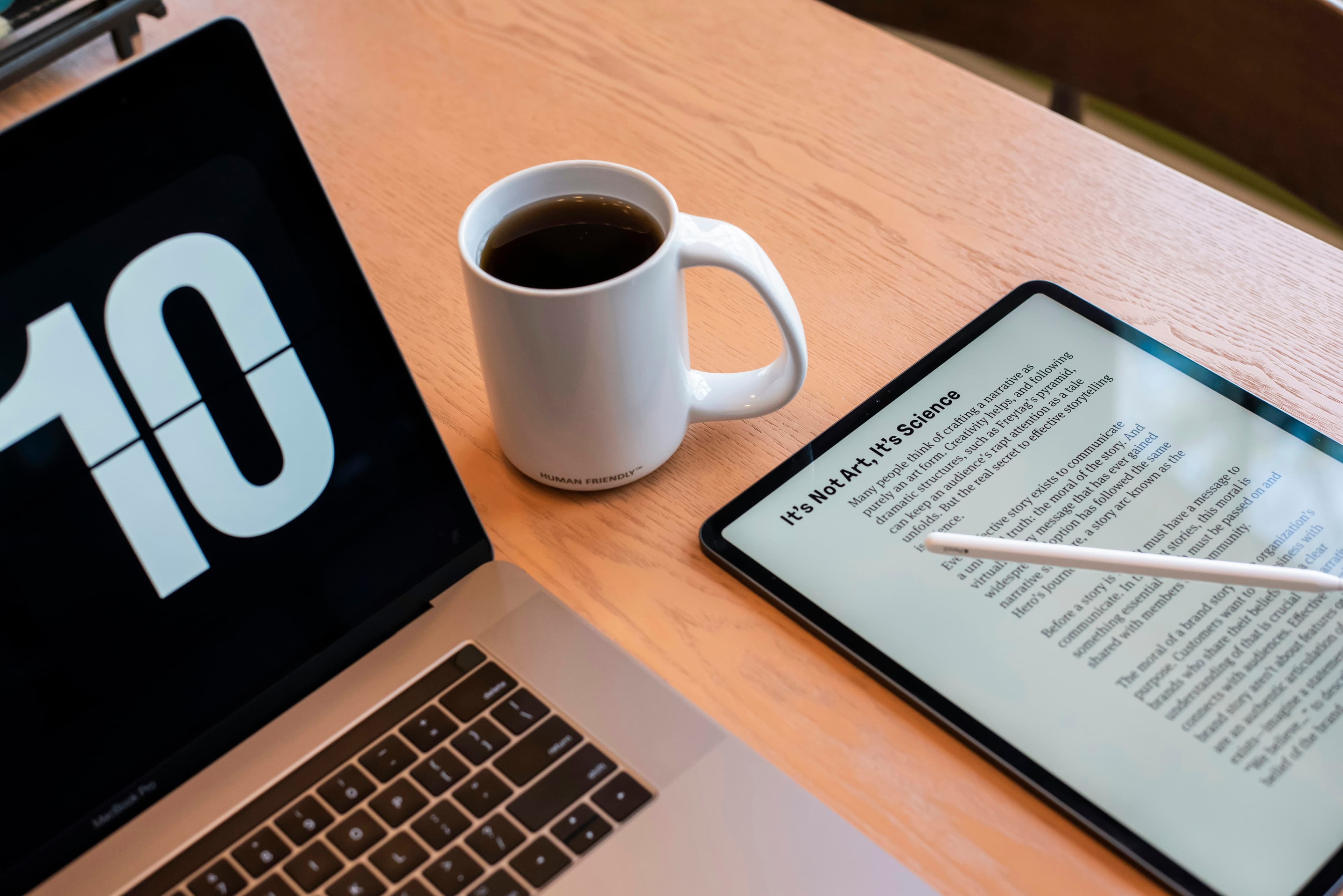 Macbook and pdfs on a tablet.
